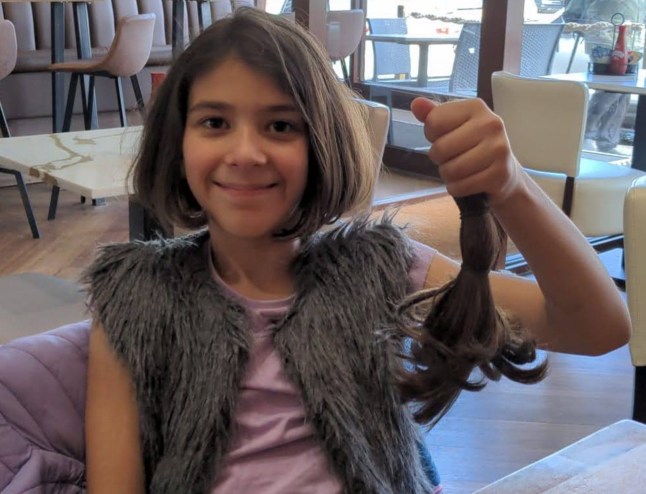 Undated family handout photo issued by the Metropolitan Police of nine-year-old Ada Bicakci from Bexleyheath, who died in the afternoon of Monday, August 5, after being hit by a bus on Watling Street, Bexleyheath, south-east London on Saturday, 3 August. This picture shows Ada holding a lock of her hair after having had her hair cut for donation. Issue date: Thursday August 15, 2024. PA Photo. See PA story POLICE Bexleyheath . Photo credit should read: Family Handout/PA Wire NOTE TO EDITORS: This handout photo may only be used in for editorial reporting purposes for the contemporaneous illustration of events, things or the people in the image or facts mentioned in the caption. Reuse of the picture may require further permission from the copyright holder.
