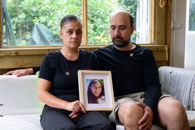 Bora and Nevgul Bicakci pictured at home in Bexleyheath, London. They hold a picture of their daughter Ada, who was killed last year by a bus driver who was high on cannabis.