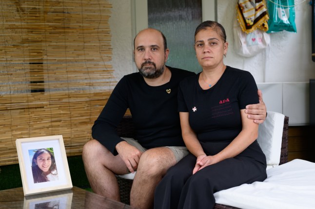 Bora and Nevgul Bicakci pictured at home in Bexleyheath, London. They hold a picture of their daughter Ada, who was killed last year by a bus driver who was high on cannabis.