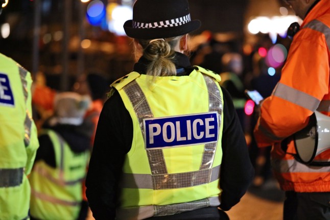 Police officer in hi-visibility jacket policing crowd control at an outside UK event; Shutterstock ID 2247052541; purchase_order: -; job: -; client: -; other: -