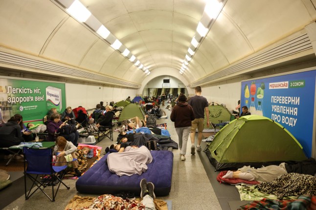 KYIV, UKRAINE - JULY 19: People take refuge in the subway, which acts as a shelter during an attack by Russian drones on July 19, 2025 in Kyiv, Ukraine. Over night the Russian army attacked Ukraine with strike drones, cruise and ballistic missiles. The following cities were hit: Pavlohrad, Odesa, Shostka, Zhytomyr, Dnipro and Poltava. Russian forces once again used the tactic of directing a large number of strike drones to weaken mobile fire groups, followed by missile strikes. (Photo by Ivan Antypenko/Suspilne Ukraine/JSC "UA:PBC"/Global Images Ukraine via Getty Images)