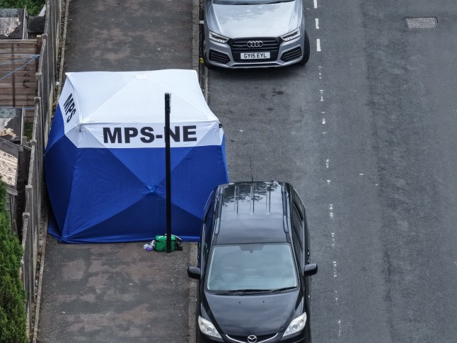 A murder investigation has been launched in Newham after a serious incident on Walton Road, with a large police presence and blue forensics tent in place since around 10am this morning. Metropolitan Police officers, forensics teams, and multiple patrol vehicles have been seen at the scene in E12, where the road remains cordoned off to the public. Witnesses report the area has been sealed off with tape, and a blue forensics tent has been erected. The investigation appears to be focused on a section of the residential street between a row of terraced homes. While full details are still emerging, early indications suggest this is being treated as a murder investigation. Forensic officers remain on scene and a post-mortem examination is expected to be scheduled. It comes just days after a separate fatal stabbing in nearby Ilford, where five people were arrested in connection with the death of a 30-year-old man. ??Area Impacted Walton Road (E12), located in the Manor Park area of Newham, remains partially closed to vehicles and pedestrians. Local residents have been advised to avoid the area while investigations are ongoing. Official Police Statement Awaited The Metropolitan Police have been approached for comment and further details are expected to be released this afternoon. Summary: Murder investigation launched ??? Walton Road, Newham E12 Crime scene in place since 10am Blue forensics tent and cordons visible Live updates ongoing Connection to other incidents unconfirmed