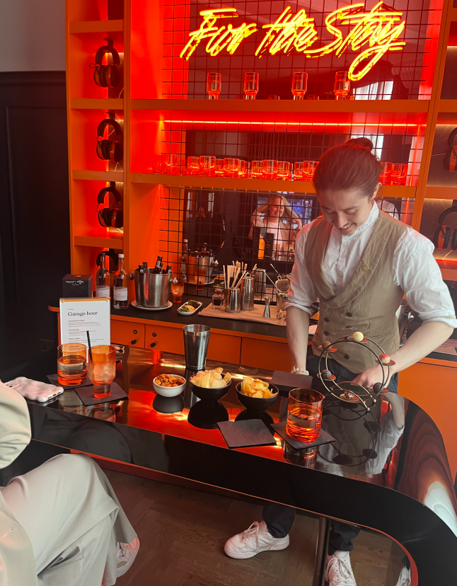 A bartender in the F1 McLaren suite at the London Hilton
